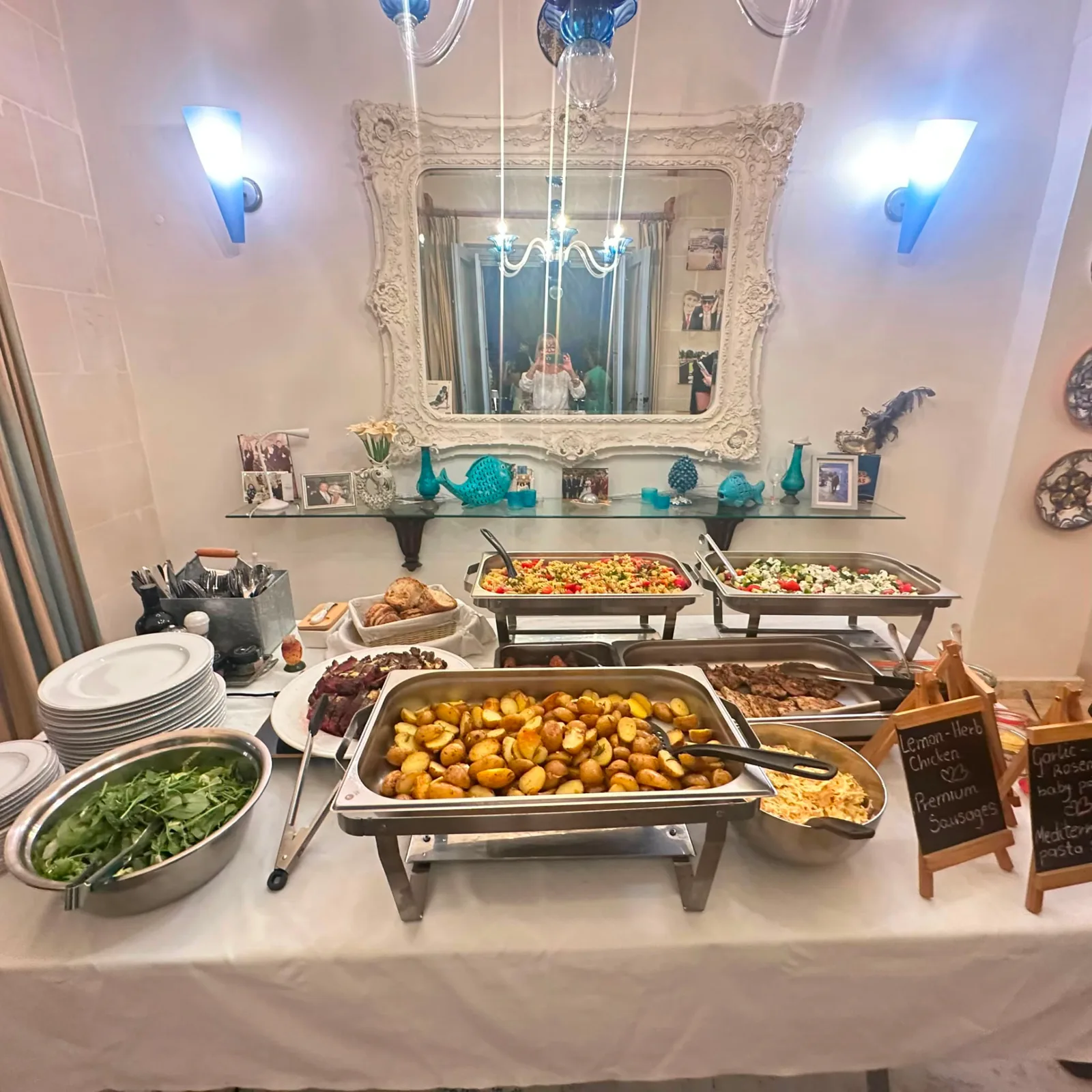 Warm buffet in chafing dishes with roast potatoes, salads and hot dishes at a private event